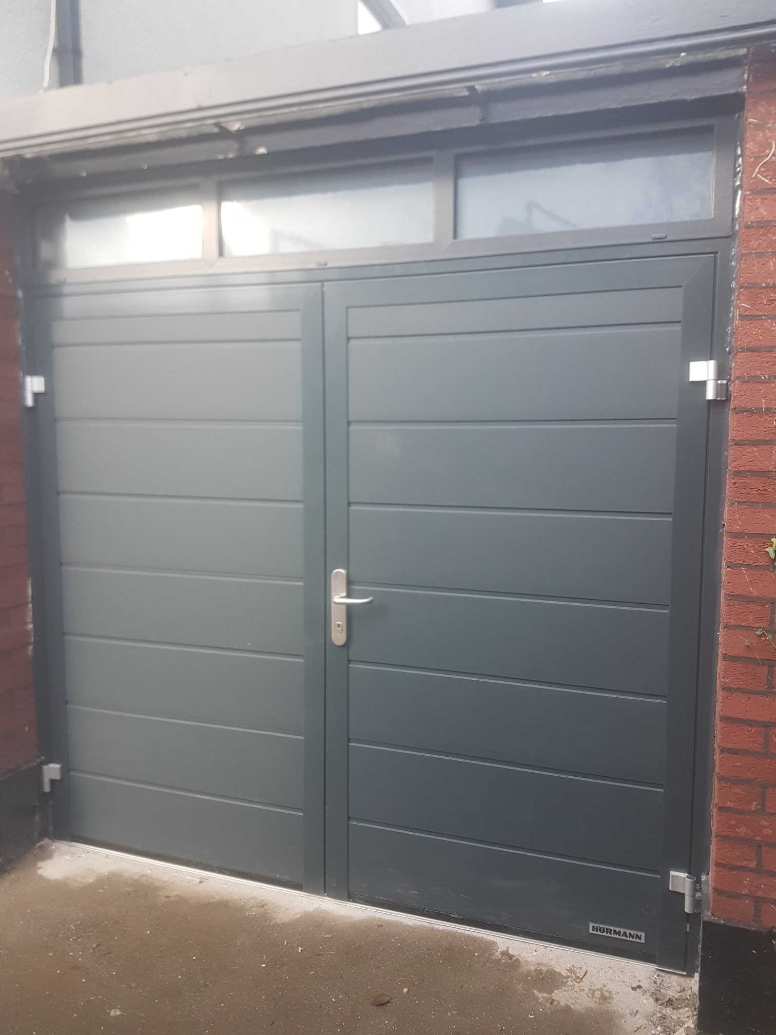 Insulated side hinged garage doors 1