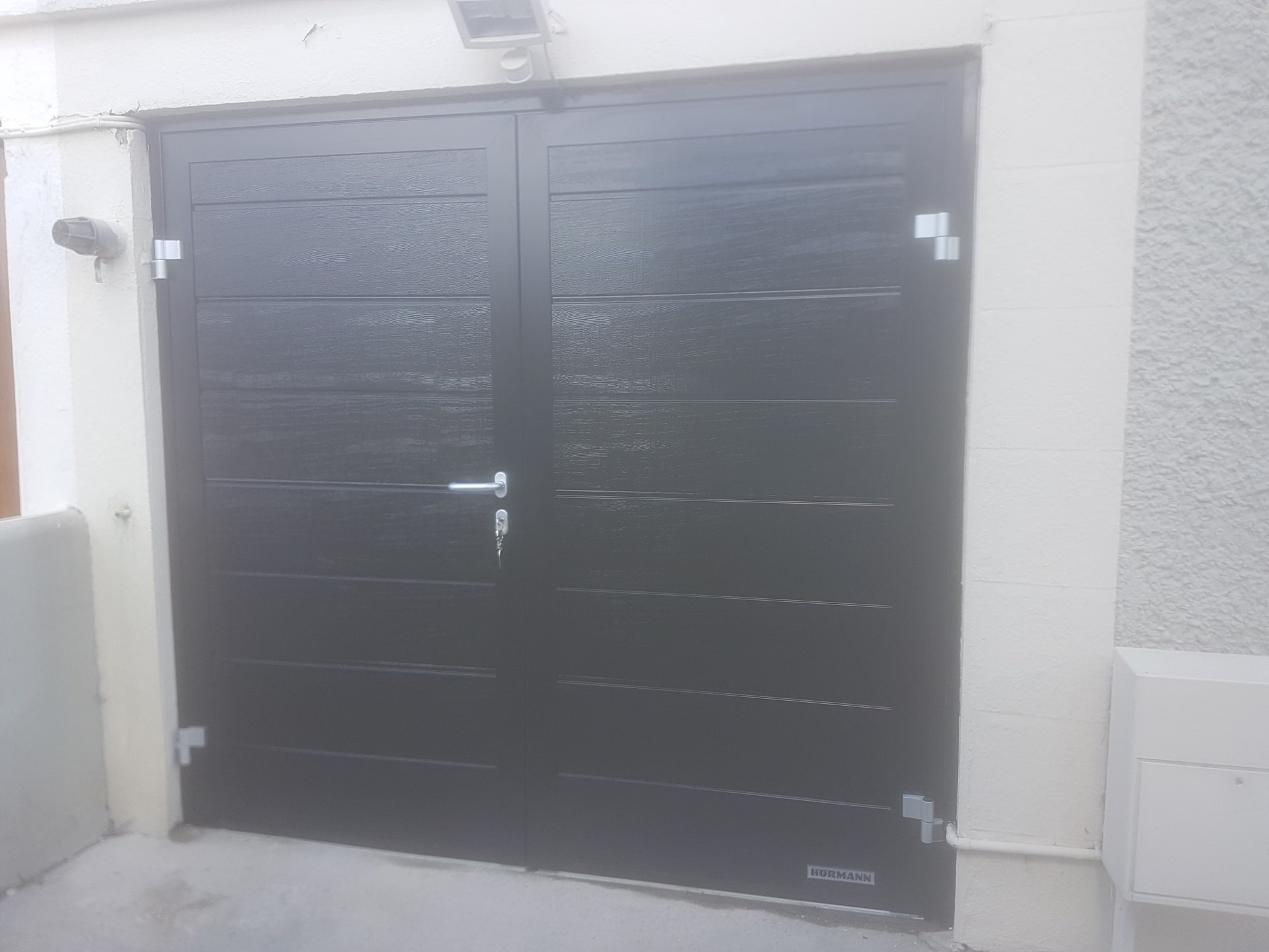 Insulated side hinged garage doors 3